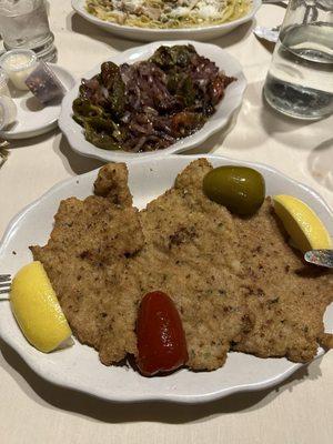 Veal Milanese with Sauteed Peppers and Onions.