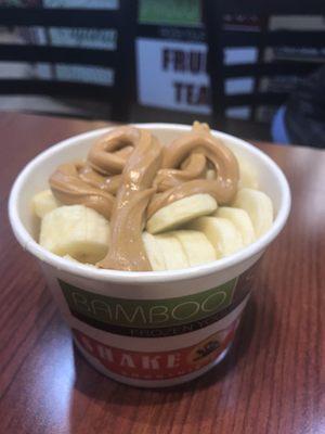 Cake batter froyo with fresh banana slices and peanut butter