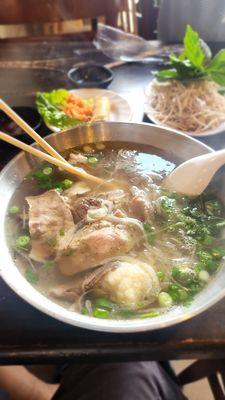 Pho with thinly sliced rare beef (cooks in the broth), lean brisket, and fatty brisket (phở tái, nạm, gầu)