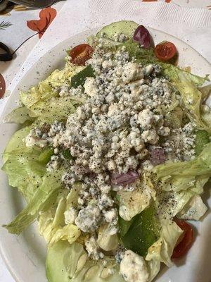 Side salad with homemade dressing and yummy bleu cheese.