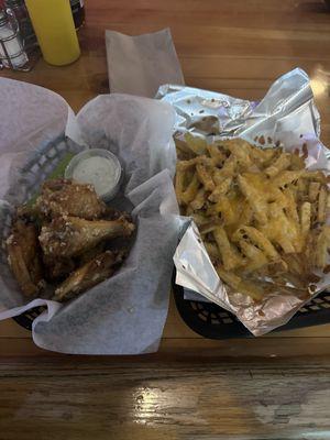 Butter and garlic wings; cheese fries.