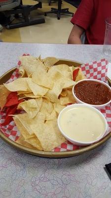 Queso,  Chips with $1. 00 added salsa. $ 2.99 chip refill and they were stale (sent back and was told they all are like that) sad  no care