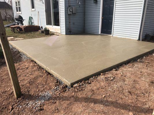 15x15 concrete pad we did. Excavated dirt, stoned, formed, and poured!