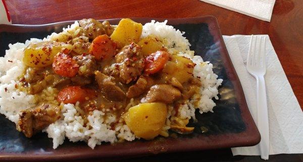 Curry Chicken, medium heat. (Options are mild, med, spicy) Comes with potatoes, carrots, rice as shown. Lots of sauce.