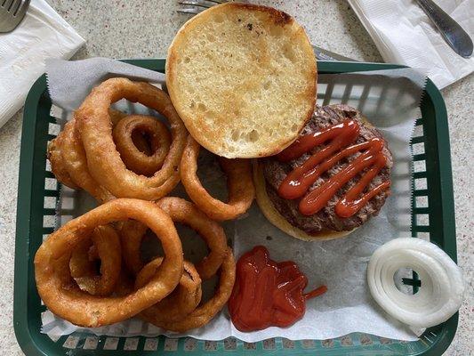 Hamburger with onion rings. Bun was toasted with butter!