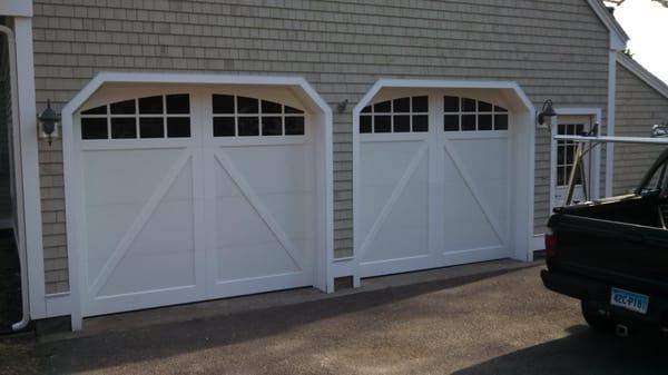 A-brace look with bright white on white.  Steel doors with vinyl overlay, maintenance free with style!