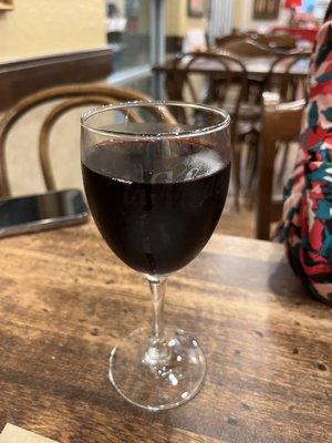 Glass of house red wine