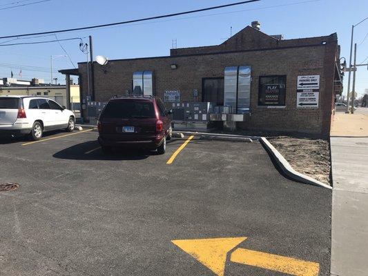 West side of building. One of the entrances is on the north side of this restaurant