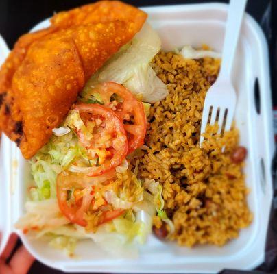 Pastelitos dinner with rice and beans and salad