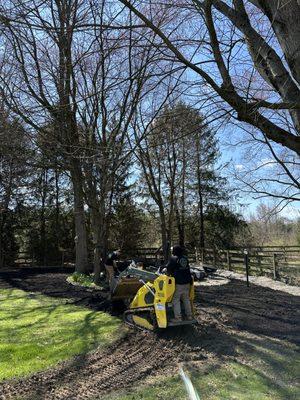 Yard grading with top soil