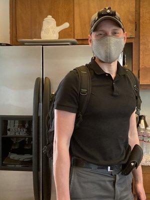 Matt in front the the fridge he just repaired. He stands by his great work