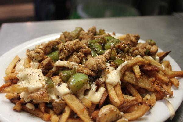 Chicken Cheesesteak Fries with green bell pepper