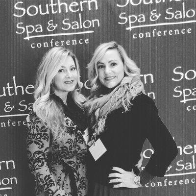 Knowledge is power! Nicole and Elise at the most recent skin care trade show.