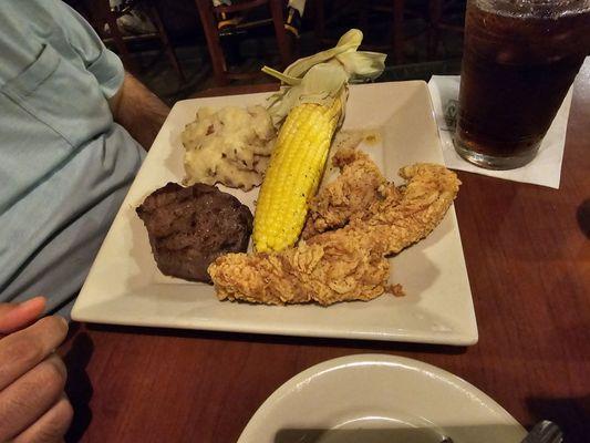 Chicken tenders and steak, with mashed potatoes and roasted corn