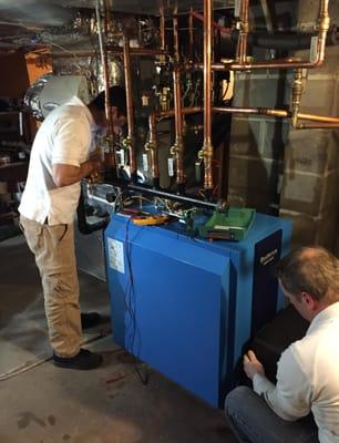 Carlos on the left, Bob on right.  This was taken at 9:00pm as they were just about to fire up the new boiler for the first time.