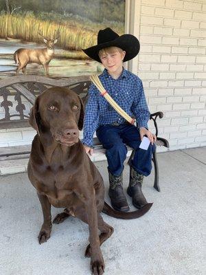 Happy new customer with store mascot Bentley!