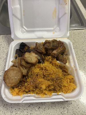 Pork with Yellow rice , fried plantains and potatoes