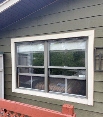 Double hung window replacement to bronze aluminum with bronze capping.