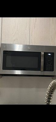 Zoom more closely to see Line beneath microwave is uneven