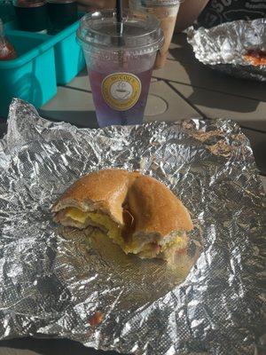 bacon egg and cheese on a bagel and shark bait lotus drink