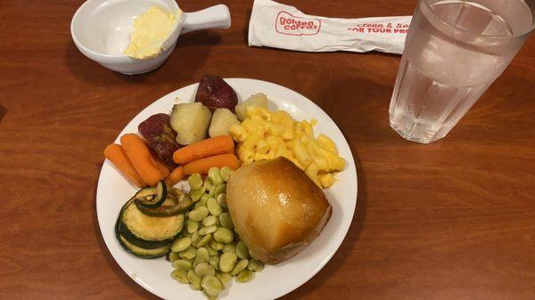 Mac n cheese, red potatoes, carrots, zucchini, Lima beans, and a roll.