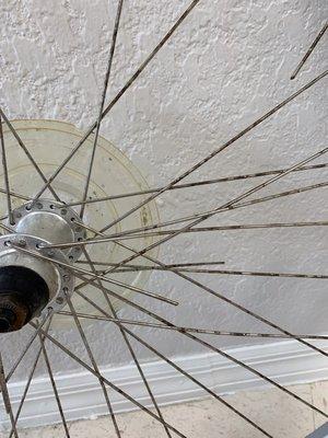 Many many bicycles have cheap Chinese spokes that corrode here by sea-side. We can rebuild them!