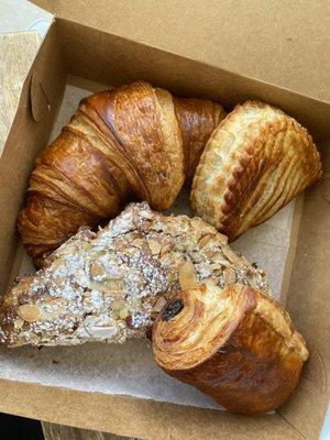 Almond croissant, PAIN AU CHOCOLAT, CROISSANT, and the French version of an apple turnover