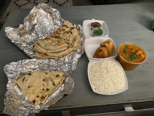 Naan, Garlic Naan, Vegetable Samosas , Basmati Rice  and Butter Chicken :)