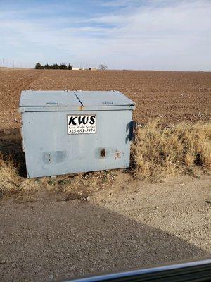 Dumpster with lid closed. They said they wouldn't pick up with open lid.