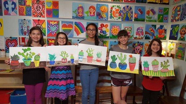 Students creating succulent paintings