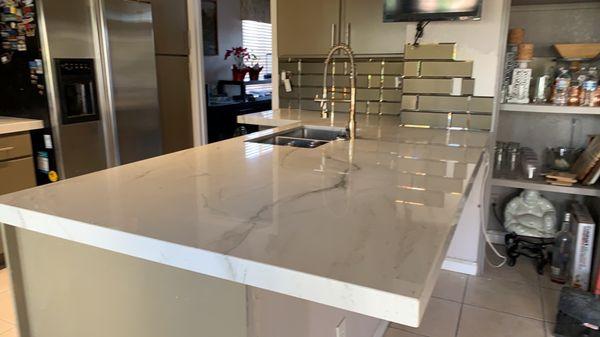 Quartzite and glass tile backsplash