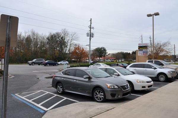 Gorgeous Parking lot view  of wells road, watch thousands of cars daily drive by...