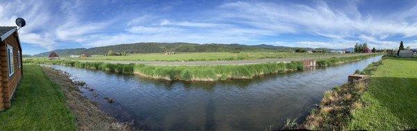 Backside view of a working farm grassland.