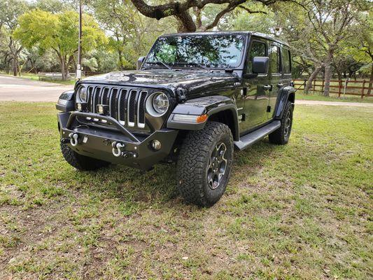 Front bumper by Rock Hard 4x4. Mike customized with an electrical plug and brake-away switch.