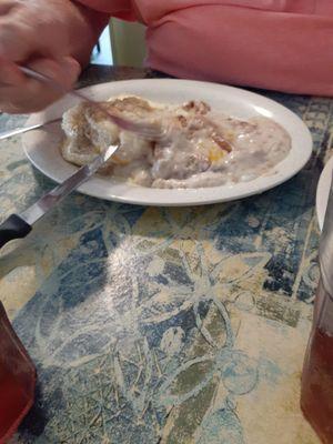 Country fried steak, eggs, and biscuit