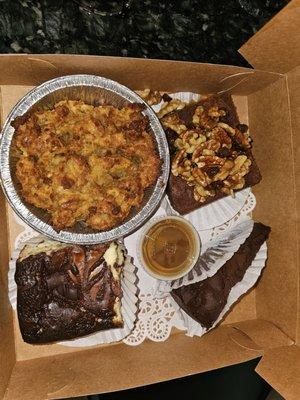 Bread pudding with caramel sauce, turtle brownie, chocolate mousse cake, and cheesecake brownie