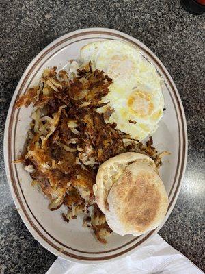 Two eggs with hash browns and an English Muffin