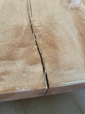 Original table with splitting crack through to underside of table