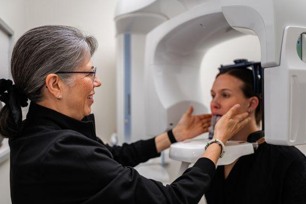 Brightening your day: Barb, our skilled assistant hygienist at work.