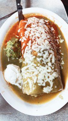 Shrimp burrito half green half red sauce