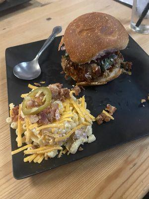 Pulled pork sandwich with their potato salad Mac & cheese