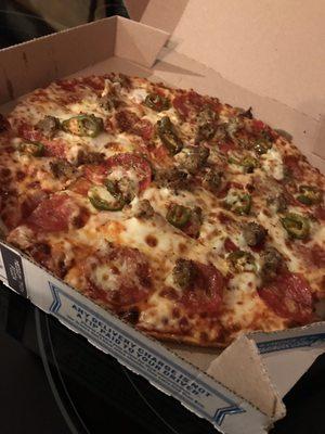 Medium Thin Crust extra sauce with pepperoni, Italian sausage, and jalapeño peppers. Yumm!