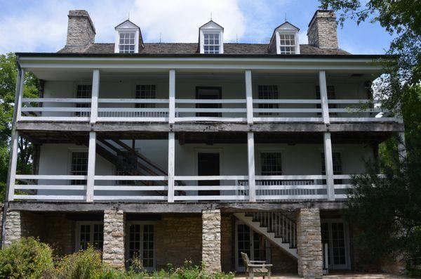 The porch side of the home looks down over part of the Femme Osage valley.