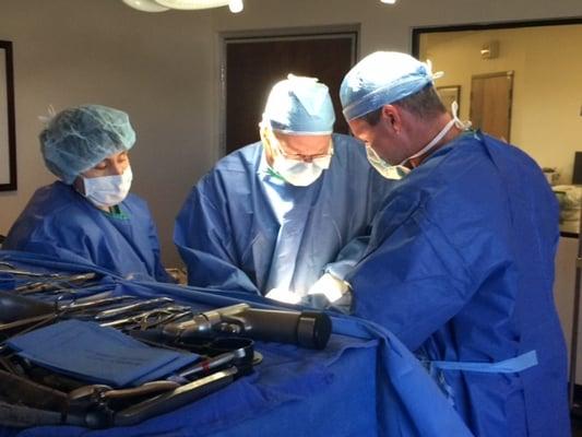 The surgical team operating on a total hip replacement.