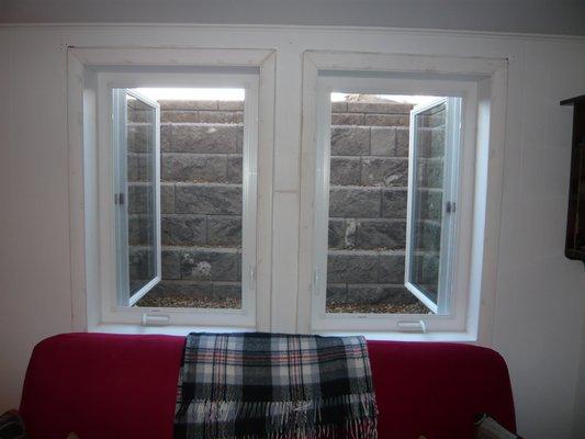 Two Casement Windows w Single Stone Window Well