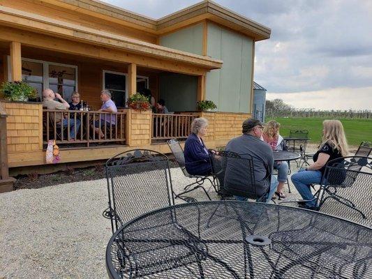 Enjoy Iowa wine with friends on the patio overlooking our Volga River Vineyard.