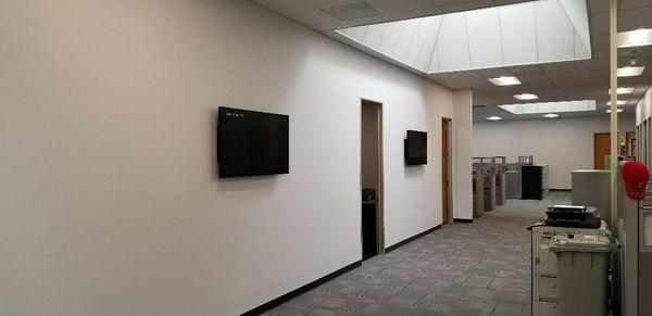 2 - 55 inch monitors in office space