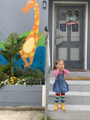 Happy kid at the front door