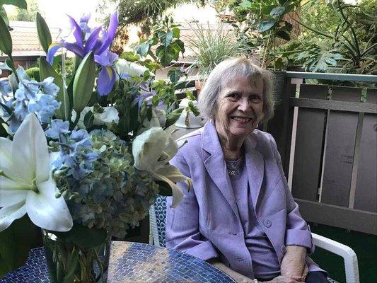 My Mom, sitting on her balcony.