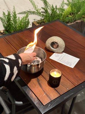 Photo of a full moon ceremony - writing what we want to release and then burning it!